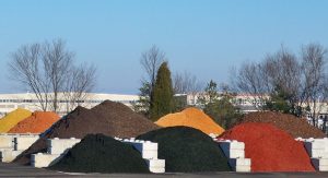 Mulch yard, bins filled with premium mulch in various shades